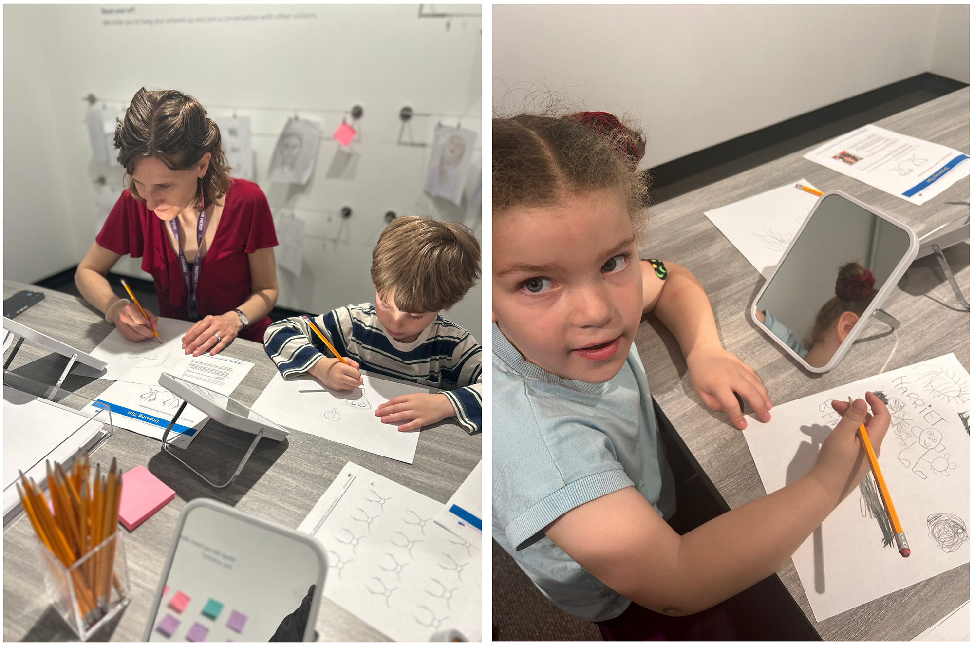Two children and an adult drawing at tables